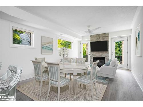 101-8 Brandy Lane Drive, Collingwood, ON - Indoor Photo Showing Dining Room With Fireplace