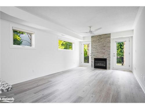 101-8 Brandy Lane Drive, Collingwood, ON - Indoor Photo Showing Living Room With Fireplace