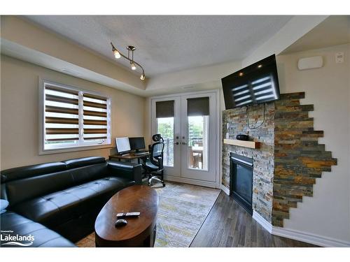 300-2 Anchorage Crescent, Collingwood, ON - Indoor Photo Showing Living Room With Fireplace