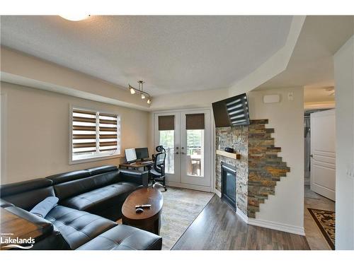 300-2 Anchorage Crescent, Collingwood, ON - Indoor Photo Showing Living Room With Fireplace