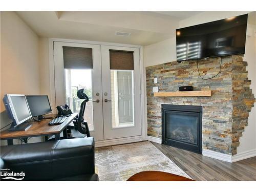 300-2 Anchorage Crescent, Collingwood, ON - Indoor Photo Showing Living Room With Fireplace