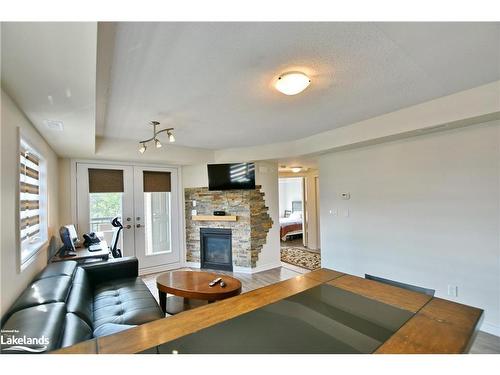 300-2 Anchorage Crescent, Collingwood, ON - Indoor Photo Showing Living Room With Fireplace