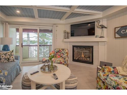 208-10 Coveside Drive, Huntsville, ON - Indoor Photo Showing Living Room With Fireplace