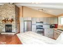 10 Sunset Court, Wasaga Beach, ON  - Indoor Photo Showing Kitchen With Fireplace 