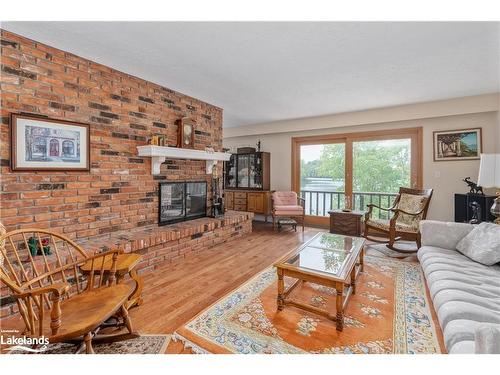 652 North Waseosa Lake Road, Huntsville, ON - Indoor Photo Showing Living Room With Fireplace