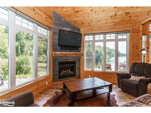 195 Charlies Lane, Huntsville, ON - Indoor Photo Showing Living Room With Fireplace