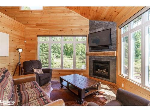 195 Charlies Lane, Huntsville, ON - Indoor Photo Showing Living Room With Fireplace