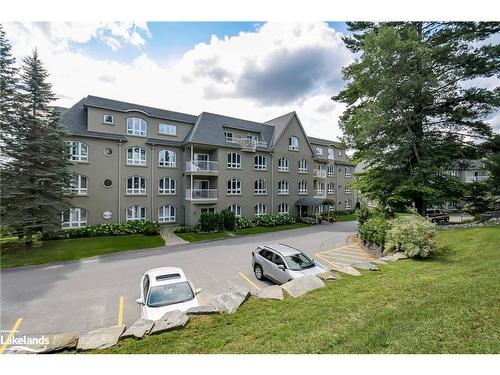 401-31 Dairy Lane, Huntsville, ON - Outdoor With Balcony With Facade