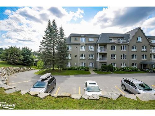 401-31 Dairy Lane, Huntsville, ON - Outdoor With Balcony With Facade