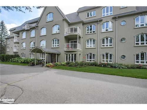 401-31 Dairy Lane, Huntsville, ON - Outdoor With Balcony With Facade