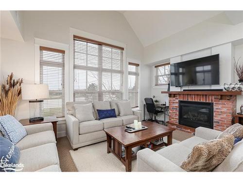 225-125 Fairway Court, The Blue Mountains, ON - Indoor Photo Showing Living Room With Fireplace