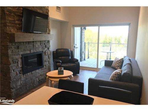 206-10 Beckwith Lane, The Blue Mountains, ON - Indoor Photo Showing Living Room With Fireplace