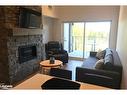 206-10 Beckwith Lane, The Blue Mountains, ON  - Indoor Photo Showing Living Room With Fireplace 