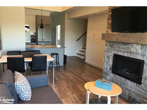 206-10 Beckwith Lane, The Blue Mountains, ON - Indoor Photo Showing Living Room With Fireplace