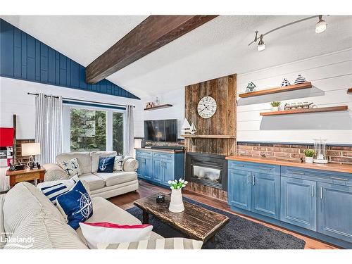 145 St Moritz Crescent, The Blue Mountains, ON - Indoor Photo Showing Living Room With Fireplace