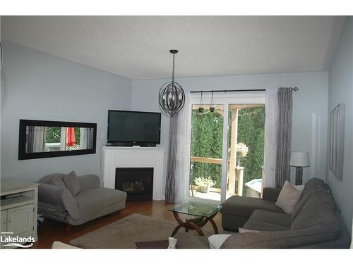 7 Sparrow Lane, Wasaga Beach, ON - Indoor Photo Showing Living Room With Fireplace