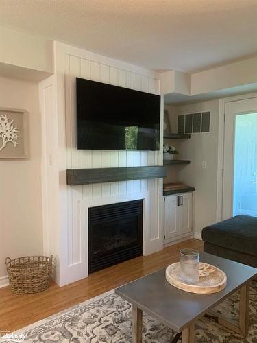 103-1 Brandy Lane Drive, Collingwood, ON - Indoor Photo Showing Living Room With Fireplace