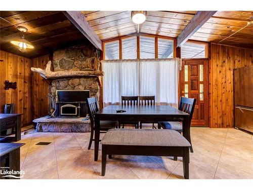 76 29Th Street N, Wasaga Beach, ON - Indoor Photo Showing Dining Room With Fireplace