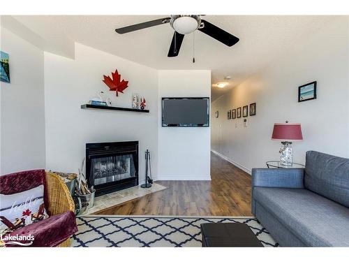 8-1064 Tiny Beaches Road S, Tiny, ON - Indoor Photo Showing Living Room With Fireplace