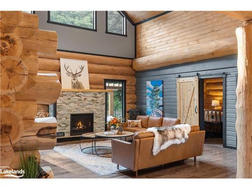 44 North Waseosa Lake Road, Huntsville, ON - Indoor Photo Showing Living Room With Fireplace