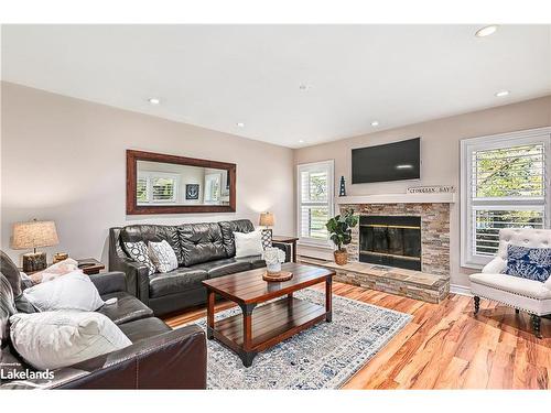 402 Mariners Way, Collingwood, ON - Indoor Photo Showing Living Room With Fireplace