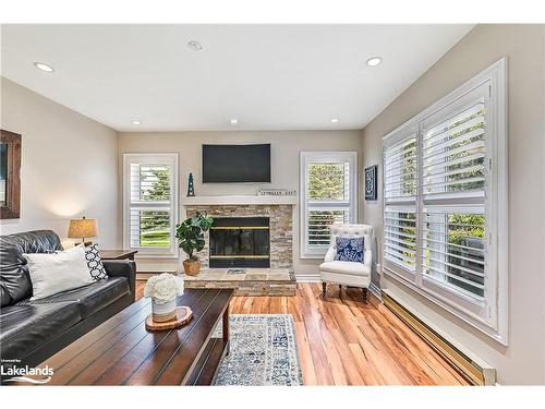 402 Mariners Way, Collingwood, ON - Indoor Photo Showing Living Room With Fireplace