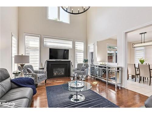 4 Clubhouse Drive, Collingwood, ON - Indoor Photo Showing Living Room With Fireplace