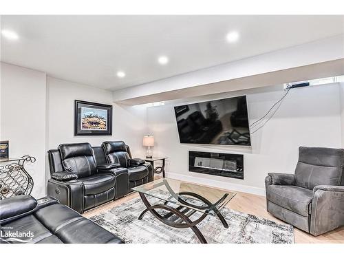 4 Clubhouse Drive, Collingwood, ON - Indoor Photo Showing Living Room With Fireplace