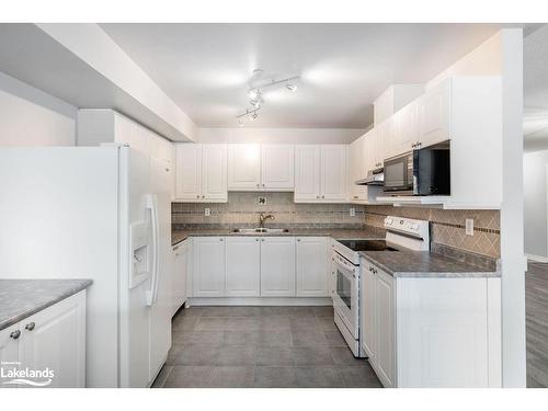 205-4 Beck Boulevard, Penetanguishene, ON - Indoor Photo Showing Kitchen With Double Sink