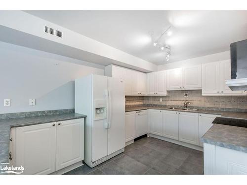 205-4 Beck Boulevard, Penetanguishene, ON - Indoor Photo Showing Kitchen With Double Sink