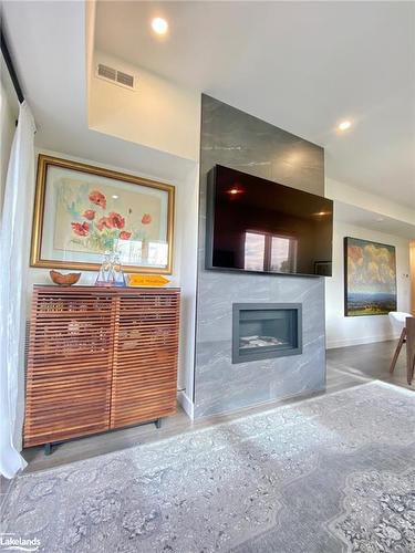 202-12 Beausoleil Lane, The Blue Mountains, ON - Indoor Photo Showing Living Room With Fireplace