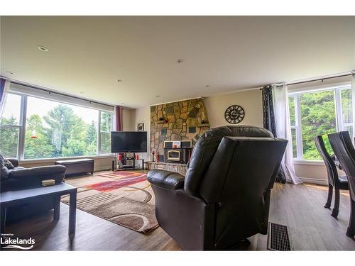 11 Gibson Road, Emsdale, ON - Indoor Photo Showing Living Room With Fireplace