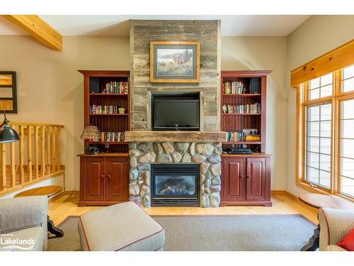 6 Wk9-1111 Dwight Beach Road, Lake Of Bays, ON - Indoor Photo Showing Living Room With Fireplace