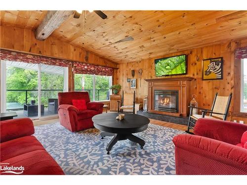 12 Maple Avenue, Huntsville, ON - Indoor Photo Showing Living Room With Fireplace