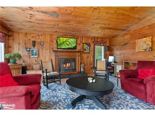 12 Maple Avenue, Huntsville, ON - Indoor Photo Showing Living Room With Fireplace