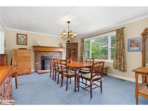 12 Maple Avenue, Huntsville, ON - Indoor Photo Showing Dining Room With Fireplace