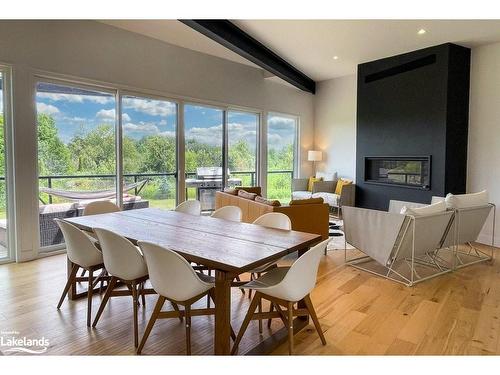 133 Young Drive, Singhampton, ON - Indoor Photo Showing Dining Room With Fireplace