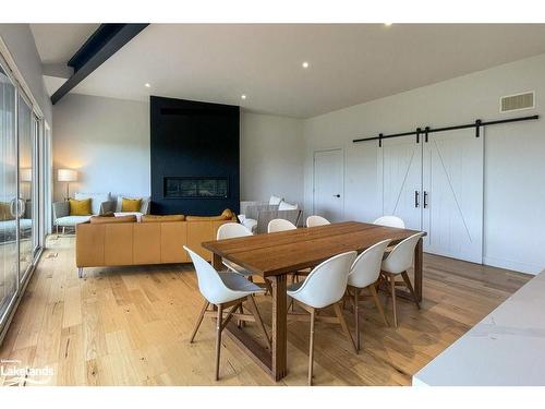 133 Young Drive, Singhampton, ON - Indoor Photo Showing Dining Room With Fireplace