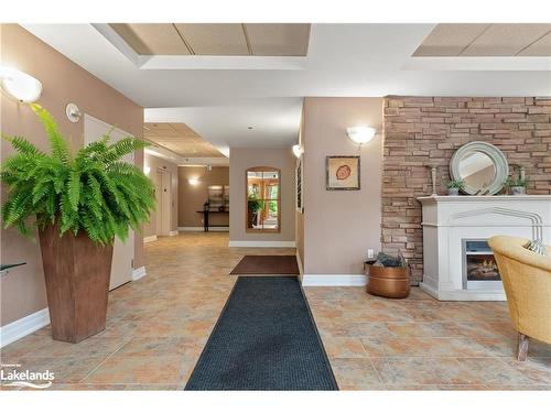 305-130 Steamship Bay Road, Gravenhurst, ON - Indoor Photo Showing Other Room With Fireplace