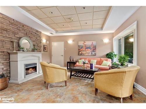 305-130 Steamship Bay Road, Gravenhurst, ON - Indoor Photo Showing Living Room With Fireplace