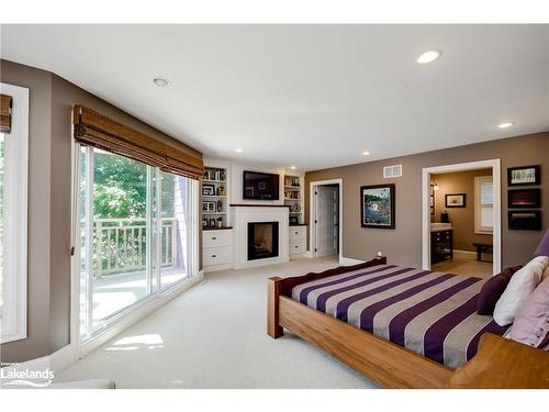 230 Ecclestone Drive, Bracebridge, ON - Indoor Photo Showing Bedroom With Fireplace