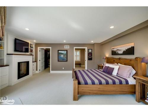 230 Ecclestone Drive, Bracebridge, ON - Indoor Photo Showing Bedroom With Fireplace