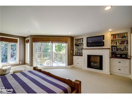 230 Ecclestone Drive, Bracebridge, ON - Indoor Photo Showing Bedroom With Fireplace