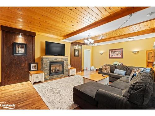 1037 Milford Bay Road, Muskoka Lakes, ON - Indoor Photo Showing Living Room With Fireplace