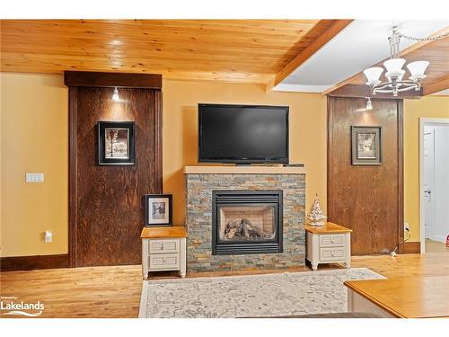 1037 Milford Bay Road, Muskoka Lakes, ON - Indoor Photo Showing Living Room With Fireplace