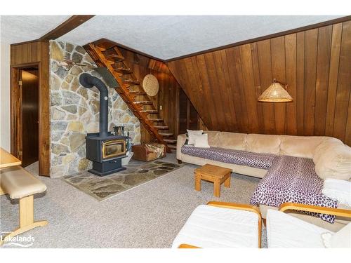 1363 West Oxbow Lake Road, Dwight, ON - Indoor Photo Showing Living Room With Fireplace