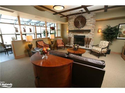 411-91 Raglan Street, Collingwood, ON - Indoor Photo Showing Living Room With Fireplace