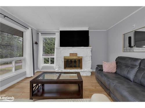 54 Machar Strong Boundary Road, South River, ON - Indoor Photo Showing Living Room With Fireplace