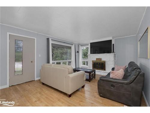 54 Machar Strong Boundary Road, South River, ON - Indoor Photo Showing Living Room With Fireplace