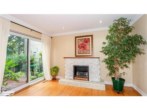 P13-25 Redstone Path, Toronto, ON - Indoor Photo Showing Living Room With Fireplace